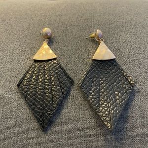 Black and gold flared diamond shaped leather earrings